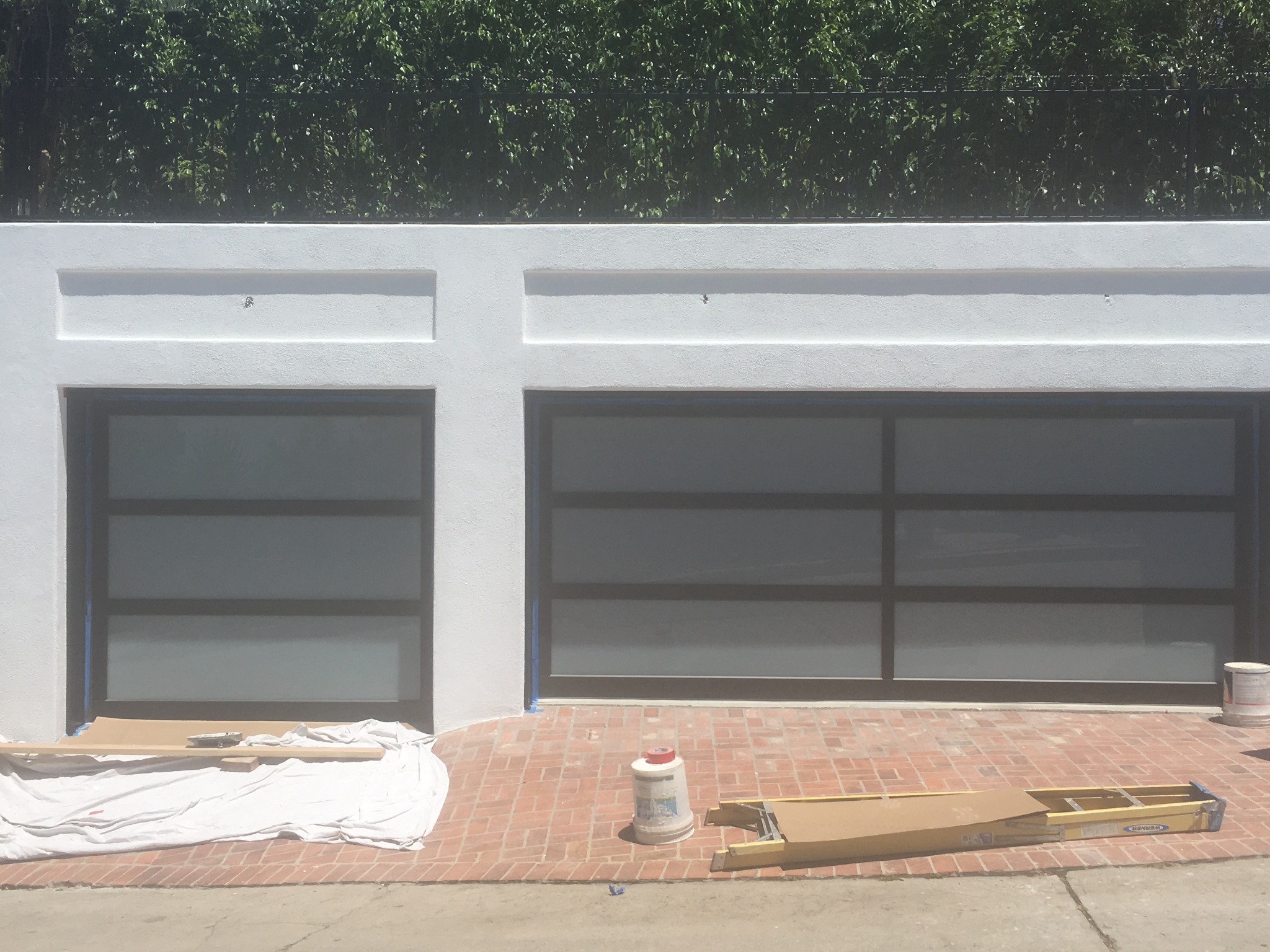 Wide black full-view garage door
