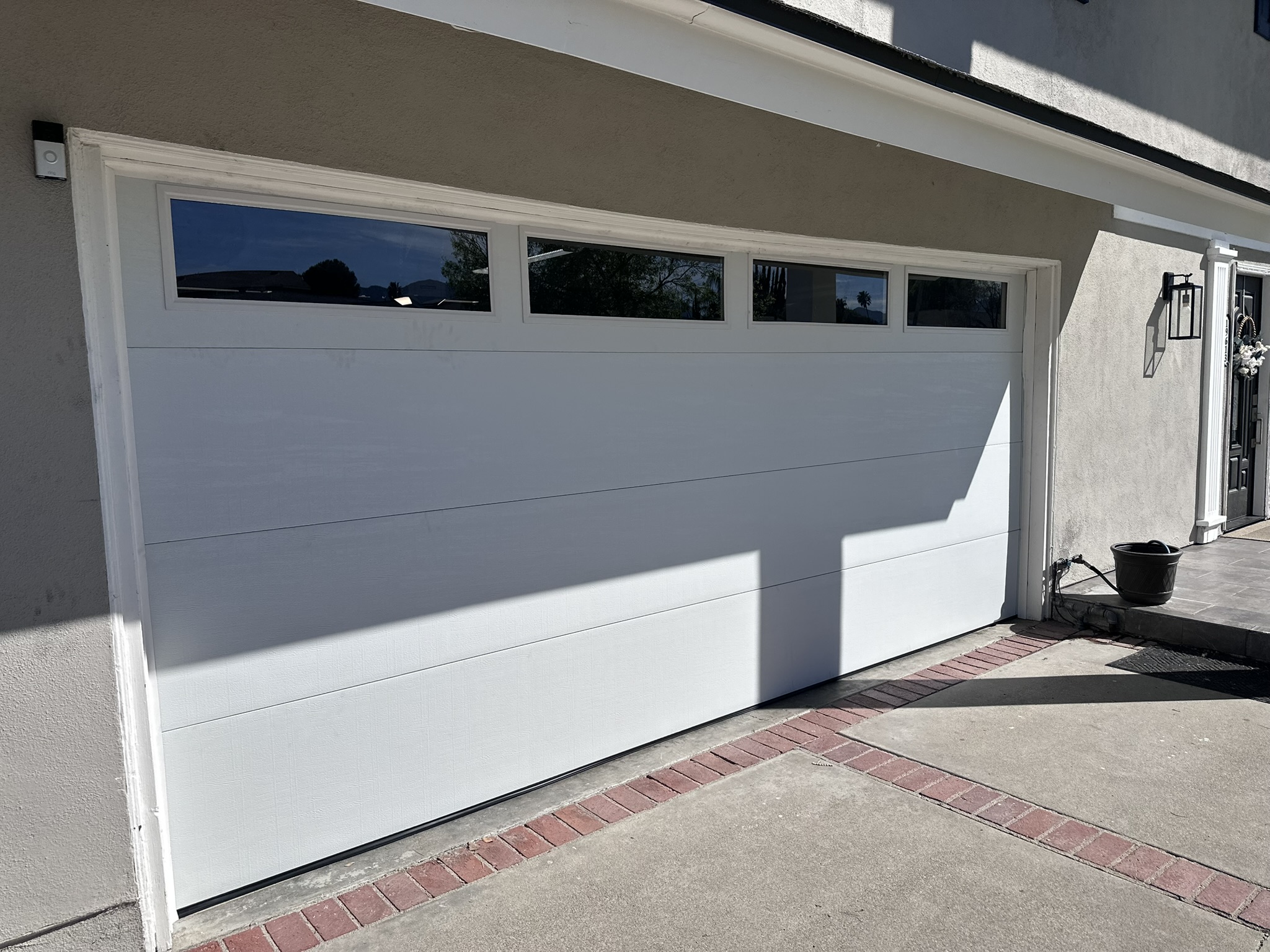 White modern garage door with top windows