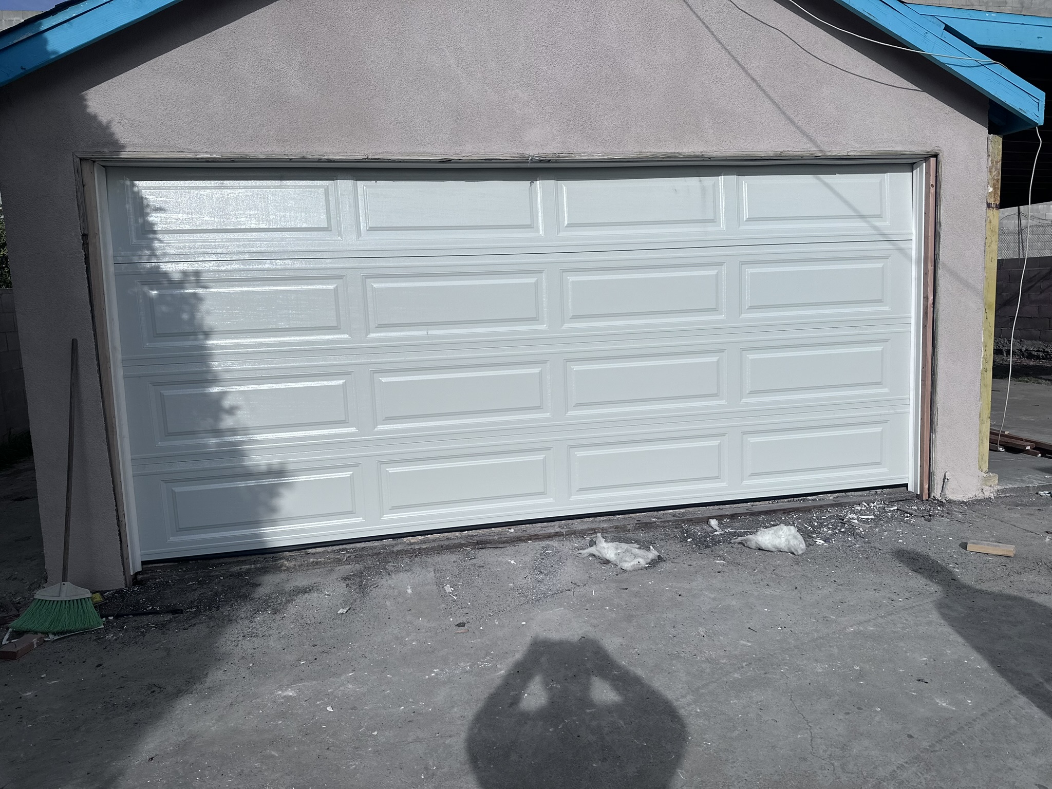 White raised-panel garage door